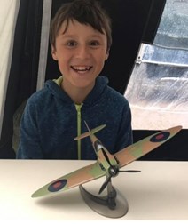 Young boy with model aeroplane