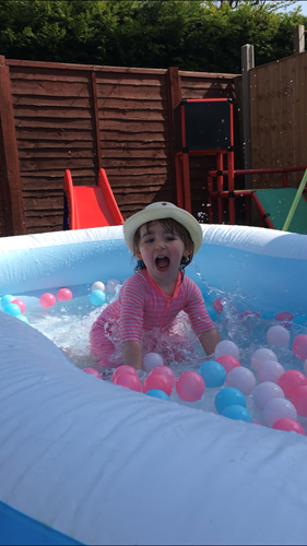 Child in paddling pool