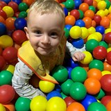 Young boy in a ball pit 