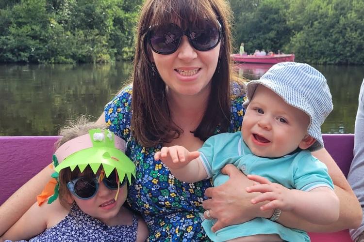 Mum, Nicky, holding Isabelle (left) and Jack (right).