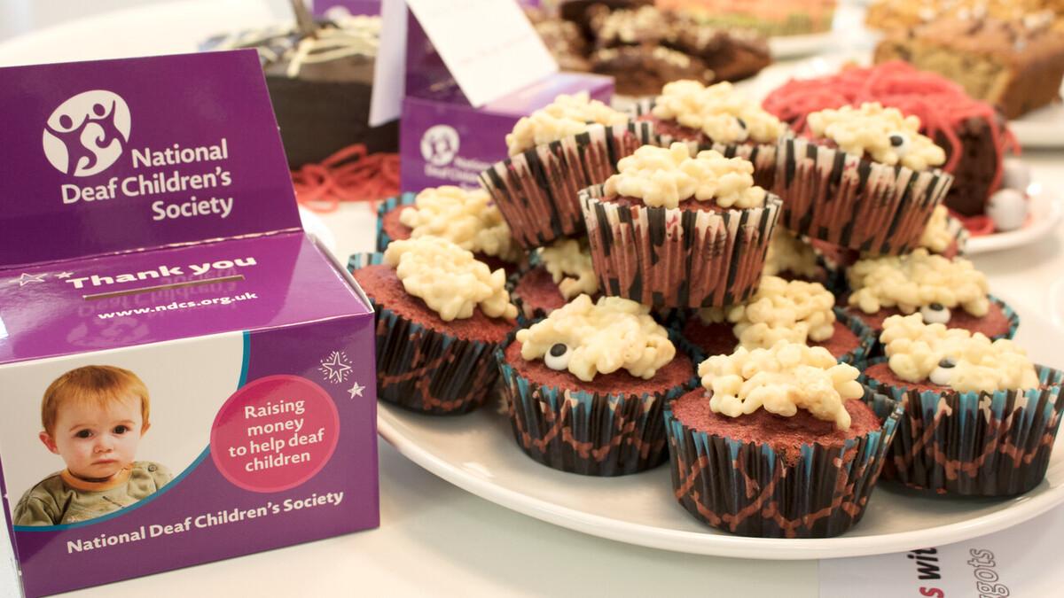 Cupcake next to a donation box for the National Deaf Children's Society