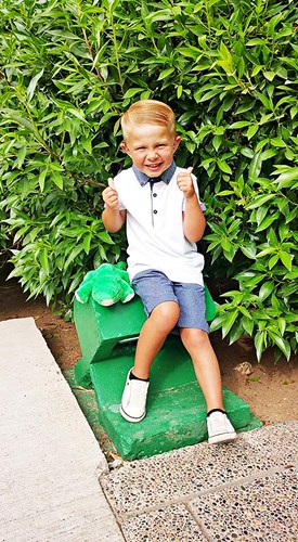 Deaf child with thumbs up