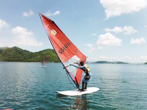 Deaf teenager windsurfing.