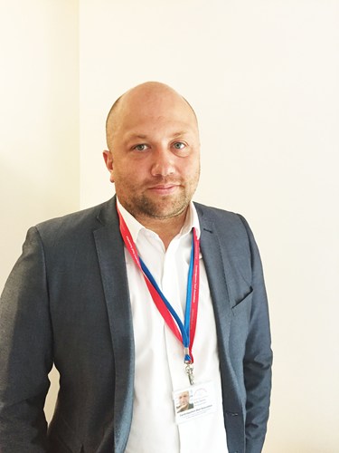 Deaf football co-ordinator wearing a suit