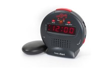 A round, black Sonic Alert Sonic Bomb Junior with red digital numbering.