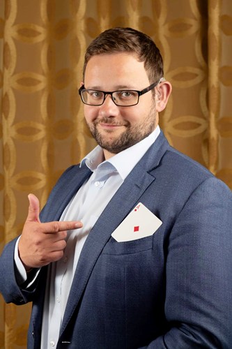 Magician with playing card