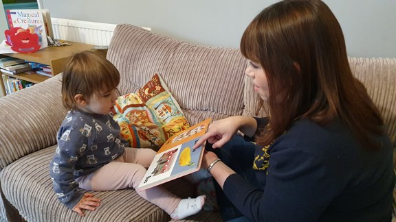 Mum reading to daughter