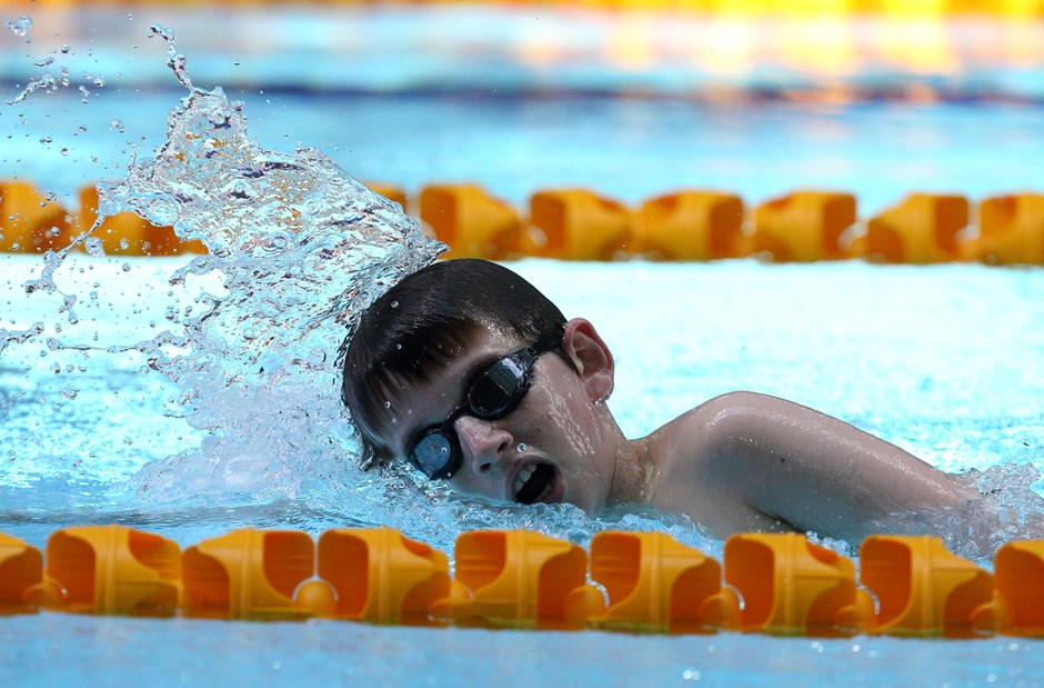 A boy swimming in a pool