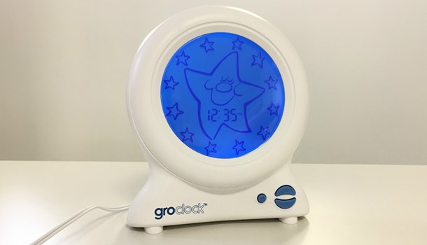White Groclock sleep trainer with round blue screen.