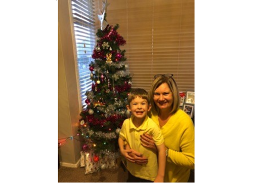 Grandparent and child with Christmas tree