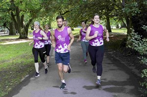 National Deaf Children's Society runners in a park 