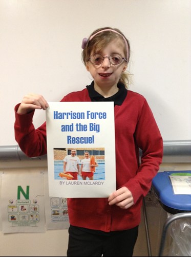 Deaf child in school uniform with book cover