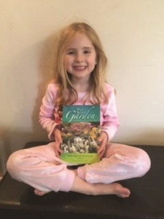 Elsie holding a copy of The Silent Garden.