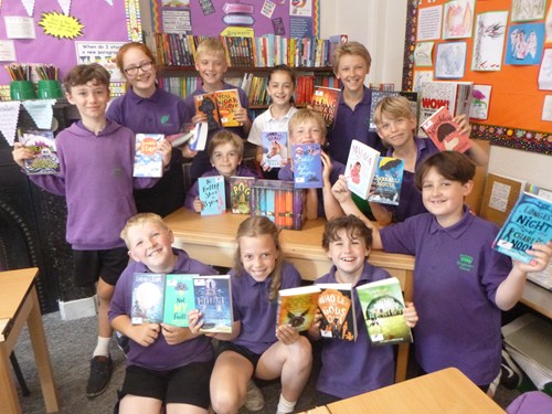 Class of children with books