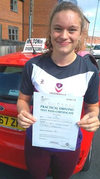 Teenage girl holding driving license certificate