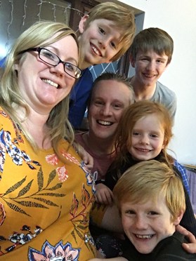 Family photo with parents and four children