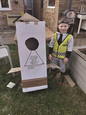 Isaac standing in his garden.