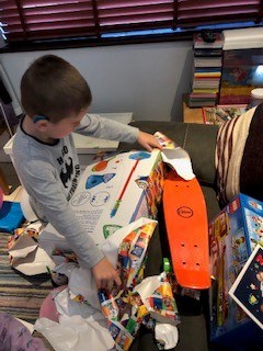 Little boy opening presents on his birthday