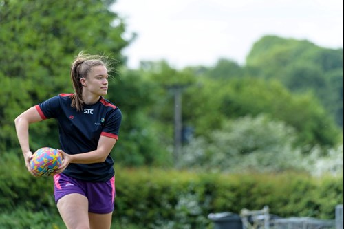 Photo of teenage girl playing rugby