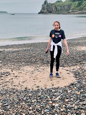 Young girl standing on the beach