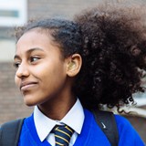 Deaf school girl smiling in playground