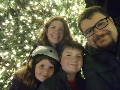Family in front of bright lights
