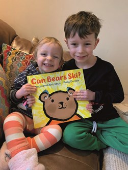 Llion (5) and sister Ania (2) hold up the Can Bears Ski? book