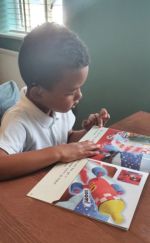 Boy reading a book