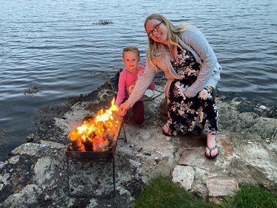 Mum and daughter with campfire