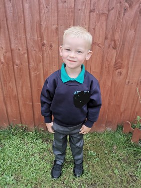 Boy outside in school uniform