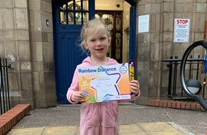 Girl standing on steps with certificate