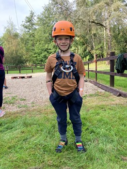 Boy outside with helmet on