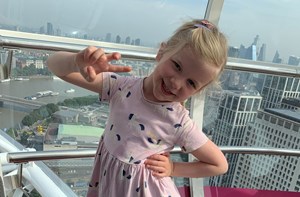 Young girl poses for the camera on the London Eye