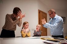 Family using British Sign Language 