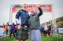 Participants cheering at the finish line of the Kiltwalk in Edinburgh 