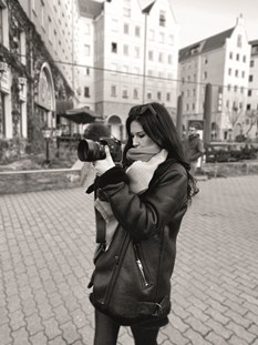 Girl outside holding camera