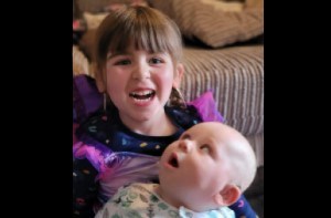 Isabelle (4) holds baby brother Jack