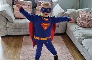 Kenzie (4) wearing a Superman costume