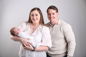 Parents Louise and Daniel hold their baby son George