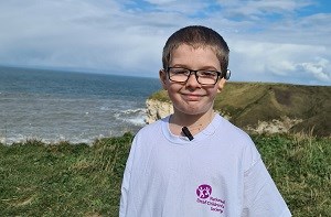 Charlie wearing a National Deaf Children's Society t-shirt