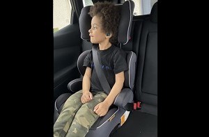 Benji (4) sitting in a car seat