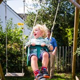 Child playing on a swing