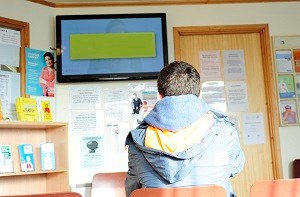 Back of man's head who is waiting in doctor's clinic