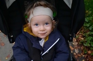 Lucas (2) sitting in a parent-facing buggy