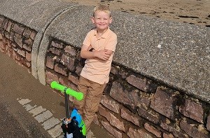 Kenzie (5) with his scooter