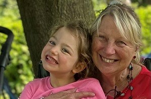 Olive (6) smiling with her grandmother