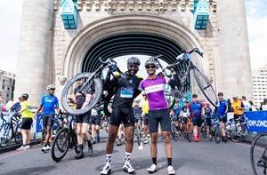Cyclists at RideLondon-Essex 100 with their bikes on Tower Bridge