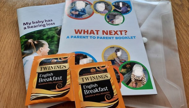 Cover of parent booklet with teabags to the side