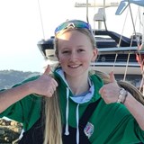 Helena (14) giving two thumbs up on a boat