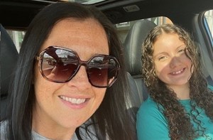 Mum Kristy in a car with her daughter, Ffion-Haf (13)